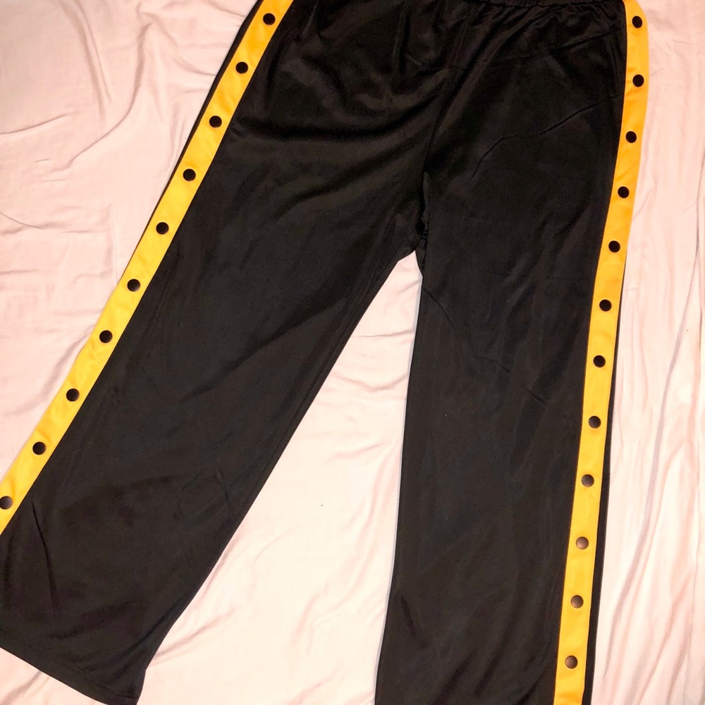 Snap away black pants with orange detail